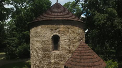 historic and renovated medieval tower in a park in a city in europe