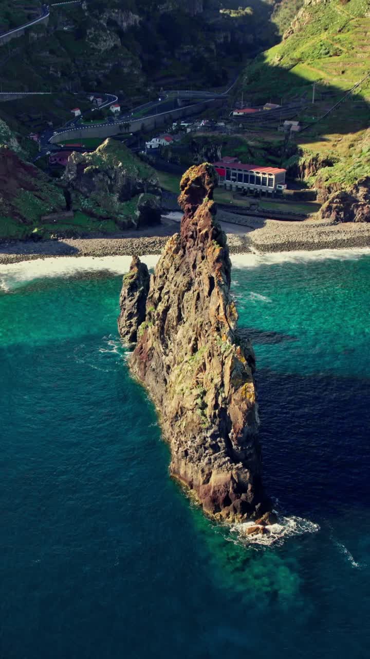 Aerial view of a volcanic rock formation off the coast