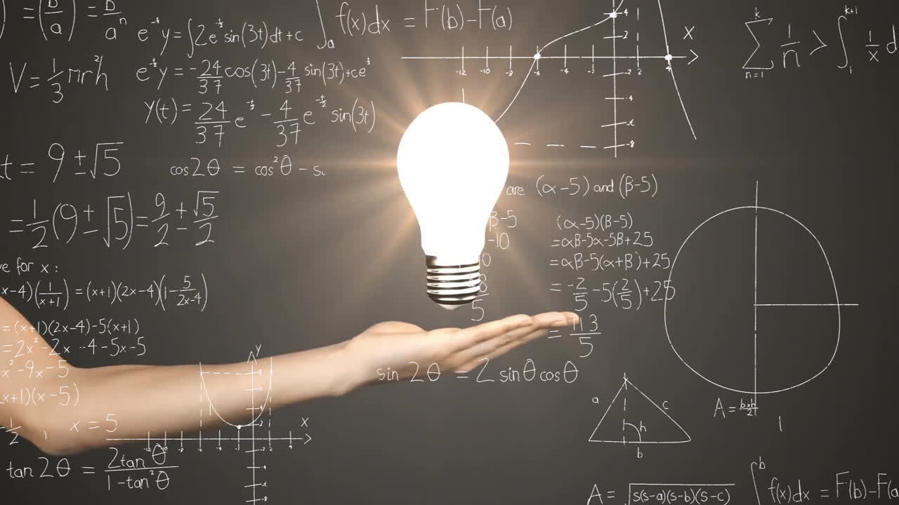 Holding glowing light bulb, hand over chalkboard with mathematical equations in school