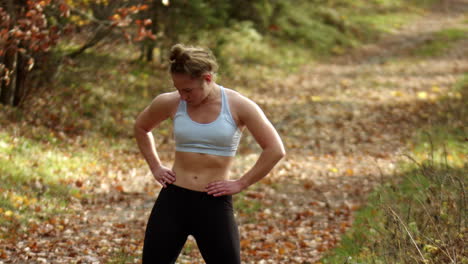 a woman doing some warm-up stretches before going for a morning run outdoors