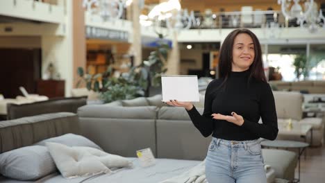 a woman elegantly showcases a variety of modern furniture within a chic and stylish showroom setting a young woman elegantly showcases a variety of modern furniture within a chic and stylish showroom setting