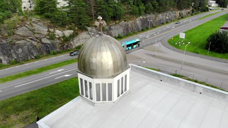 drone orbit around bronze dome of orthodox church, gothenburg, sweden