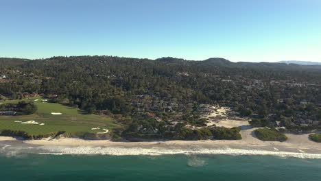 waterfront homes real estate in carmel by the sea, california, seen from above water, drone forward motion