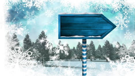 nieve cayendo y cartel de madera