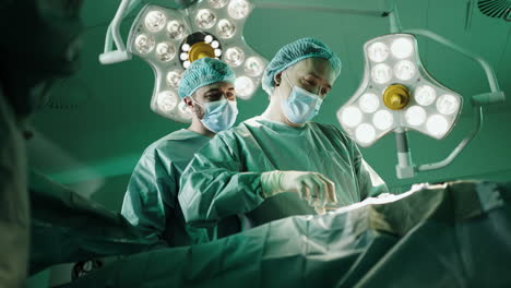 surgeons performing surgery in an operating room