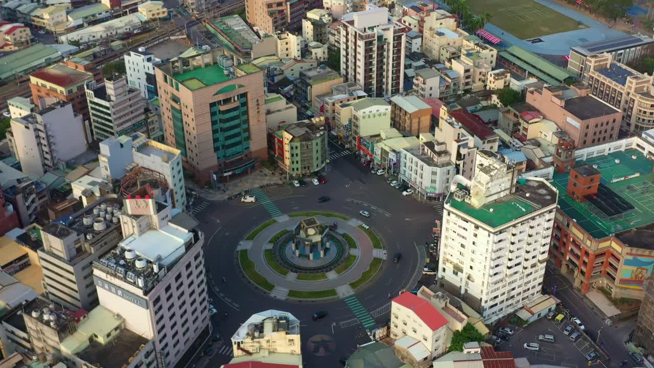 Aerial View of a City Roundabout with Surrounding Buildings