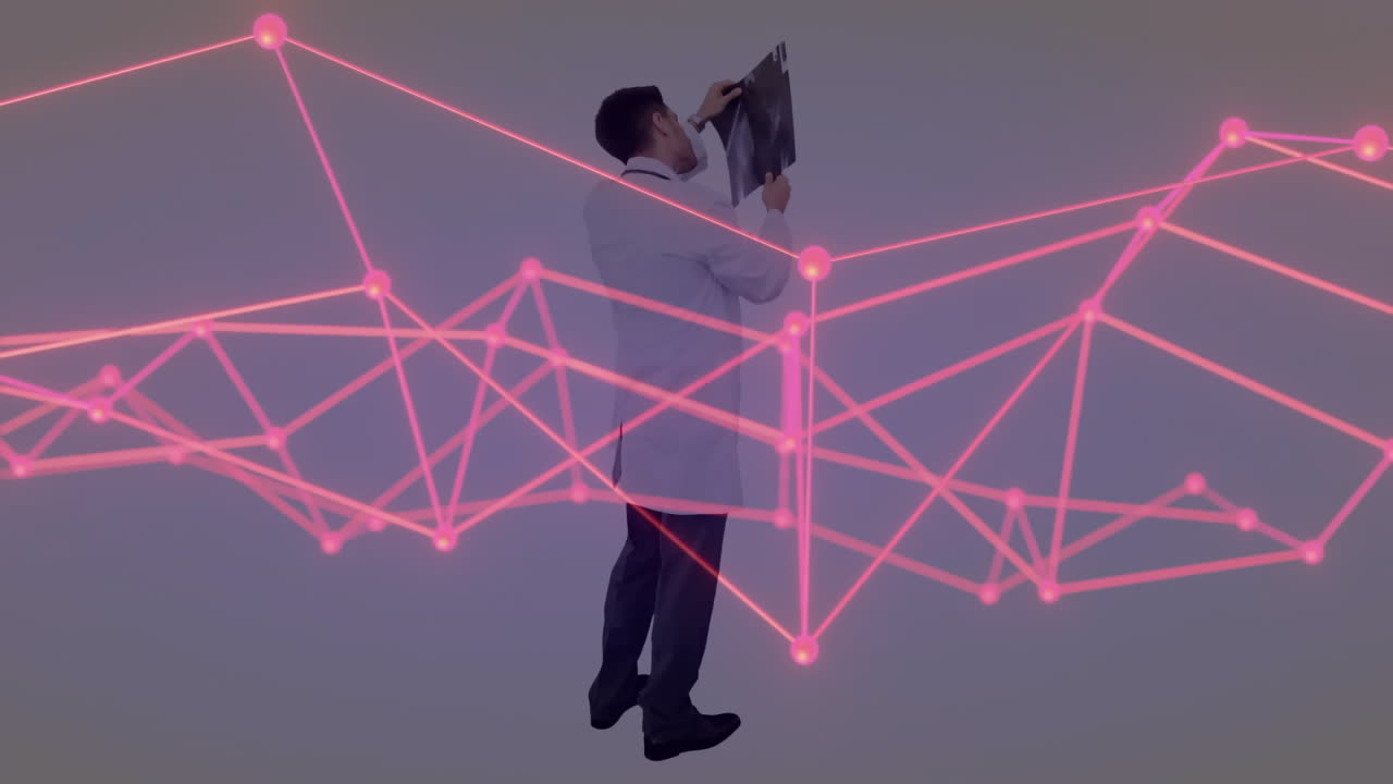 man examining X-ray film in health technology studio, with pink digital network overlay
