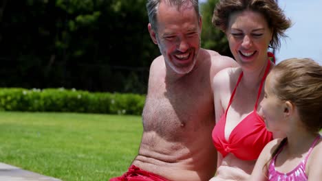 Family-enjoying-in-swimming-pool-