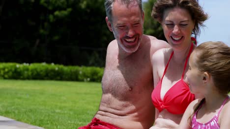 family enjoying in swimming pool