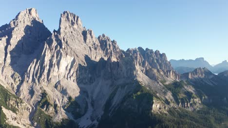 Aerial-of-Monte-Cristallo-mountains-with-blue-sky-and-sun-rising