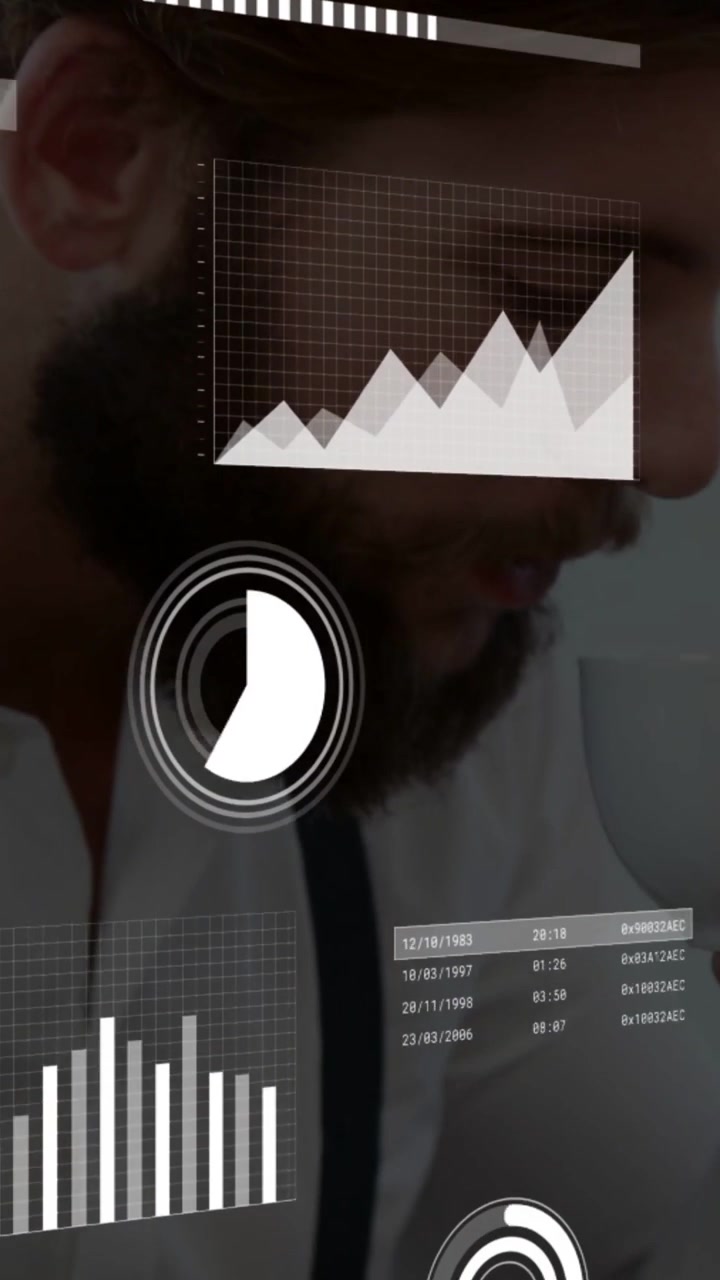 Vertical video: Man placing cup down, pressing keys and pointing, checking business charts updating