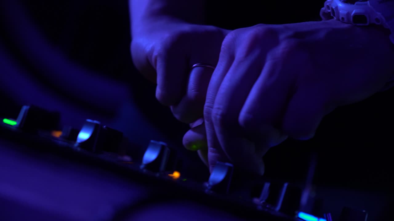 DJ Mixing at Night