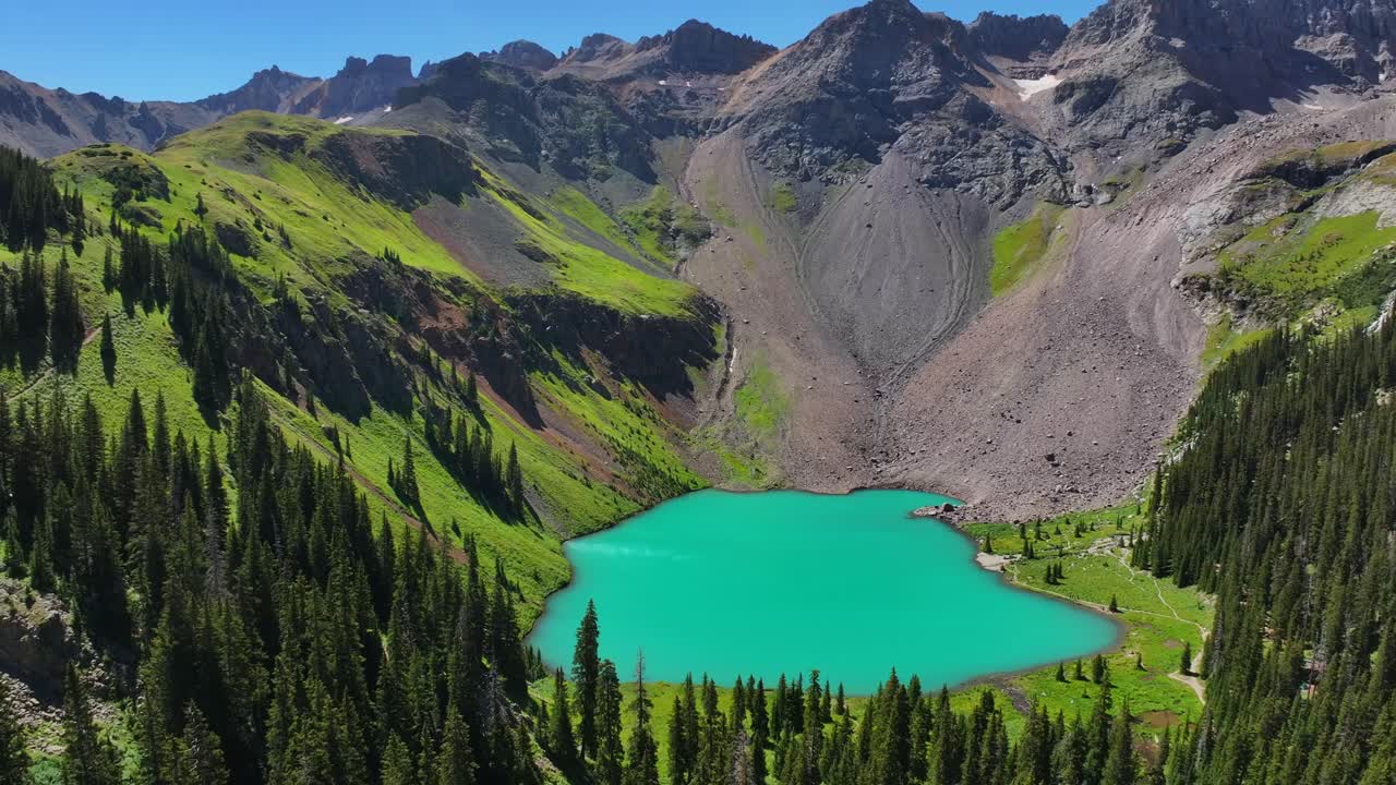 Lower Blue LakeMount Sneffels Wilderness beautiful sunny morning Ridgway Telluride Colorado aerial drone San Juan Rocky Mountains Uncompahgre National Forest Dallas Range blue sky circle right pan up