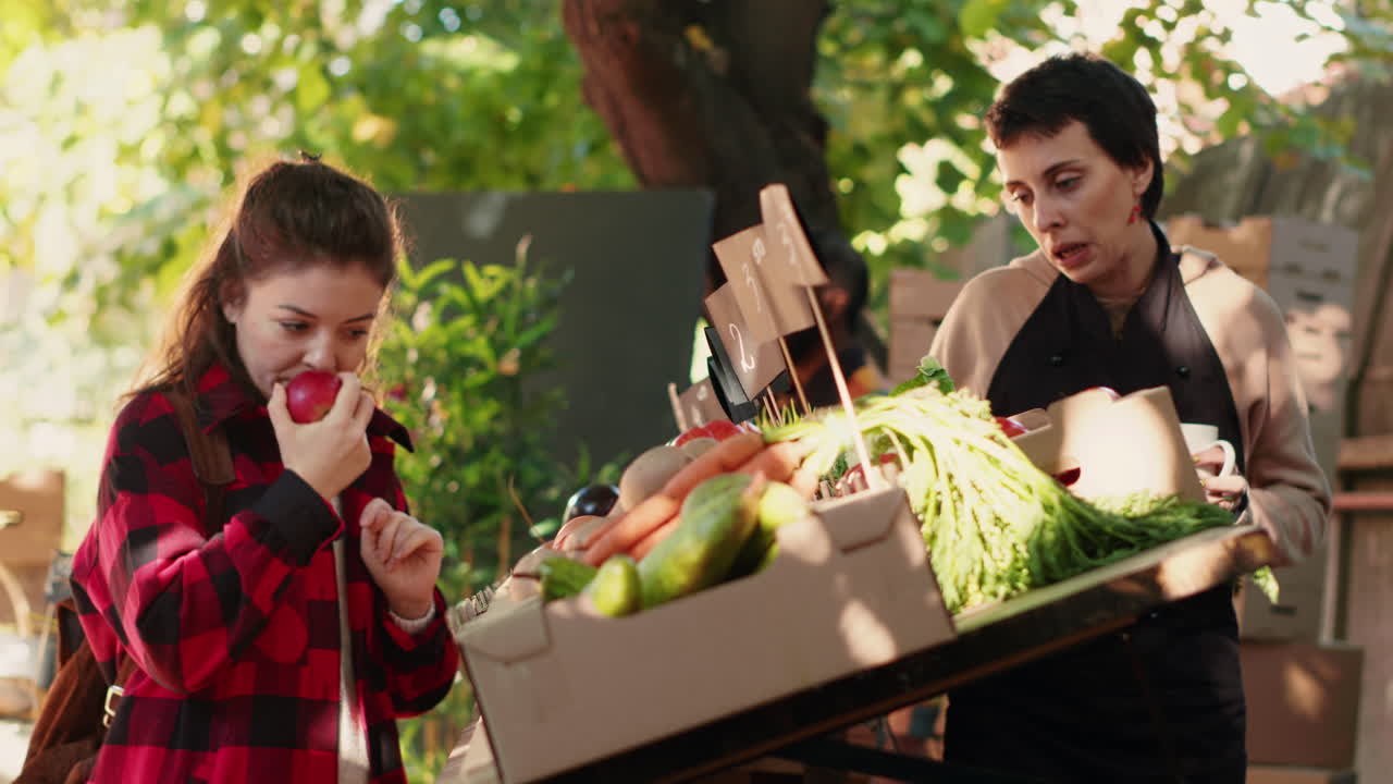 Women shopping for fresh produce at a farmers market