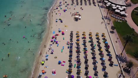 Overhead-approaching-drone-shot-of-the-long-coastline-of-Cala-Mayor-located-in-Palma-de-Mallorca,-in-the-Mediterranean-Sea