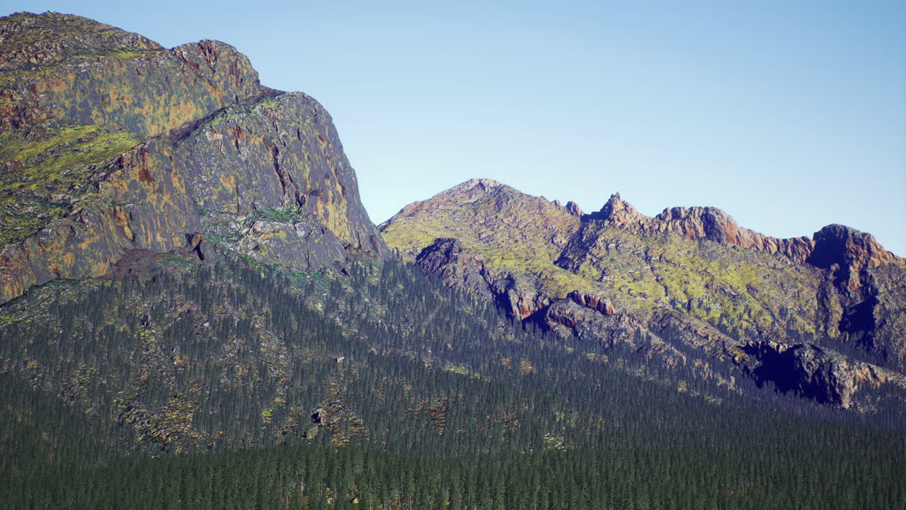 Mountain landscape with greenery under clear blue sky in daylight