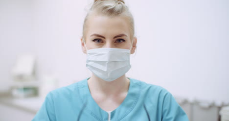 Female-Doctor-Wearing-Protective-Mask-On-Face-And-Put-Glasses-Doctor-At-Healtcare-Clinic