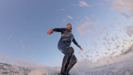 clip of surfer performing a backside re-entry at point break beach in cascais