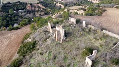 aerial 360 around ruin of farmhouse on hillside in catalonia landscape