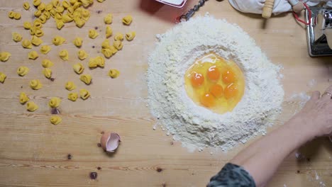 ingredients for tortellini on wooden table