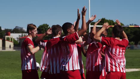 rugby players celebrating on the field