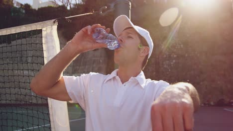 Man-playing-tennis-on-a-sunny-day