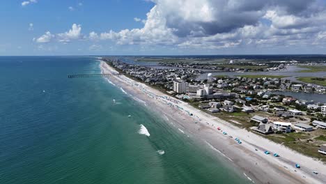 aerial view beautiful beach with golden sand and beach umbrellas glide over a beautiful beach featuring golden sand and beach umbrellas captured in