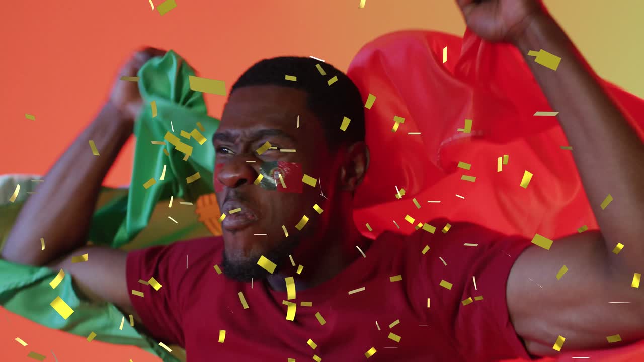 Animation of african american male supporter with flag of portugal over confetti