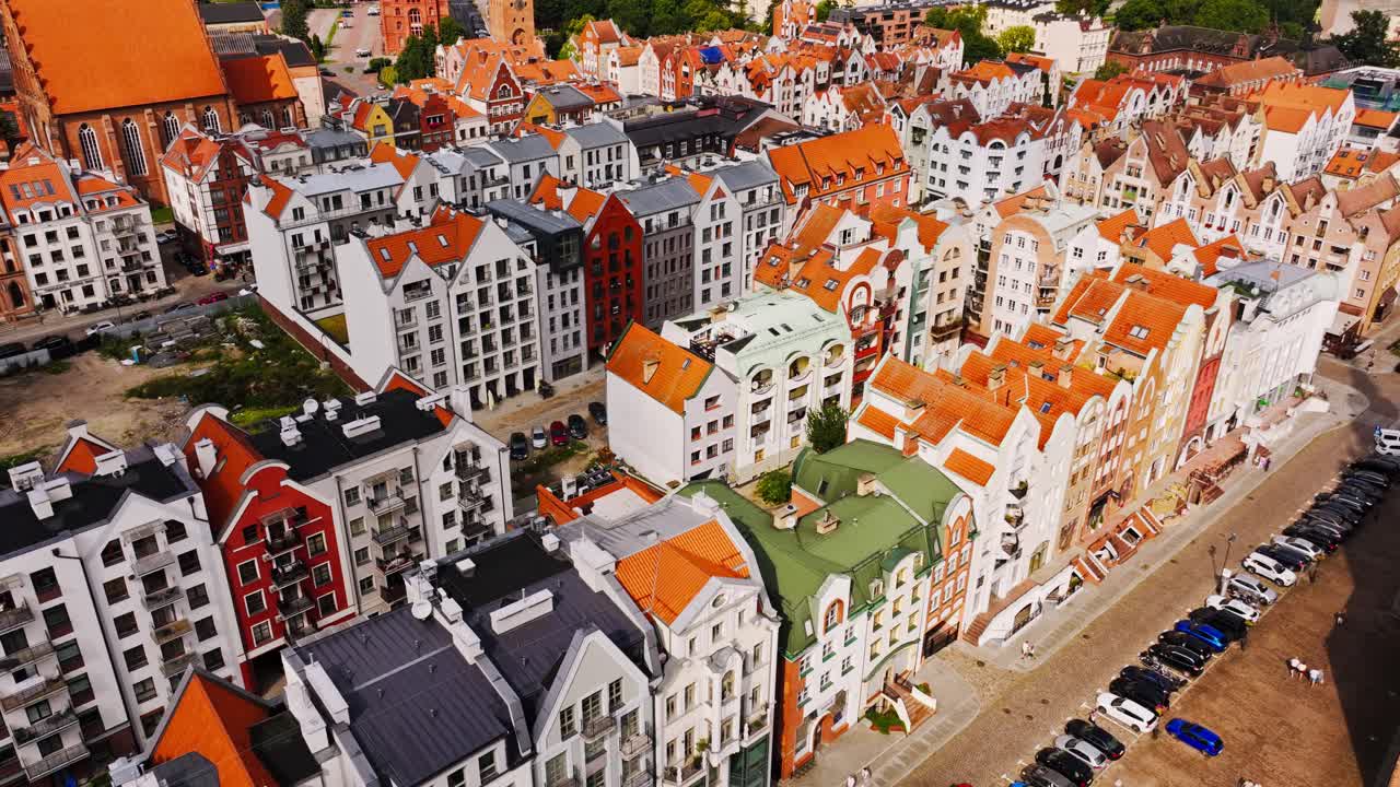 Colorful old town buildings shine in cinematic motion and warm daylight