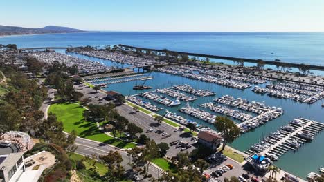 dana point harbor and marina with yachts and sailboats in california, united states - aerial shot