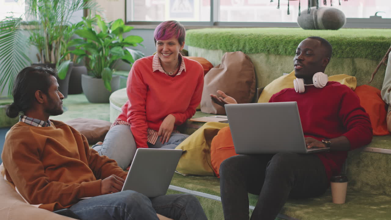 Young People Chatting in Lounge of Start-Up Office