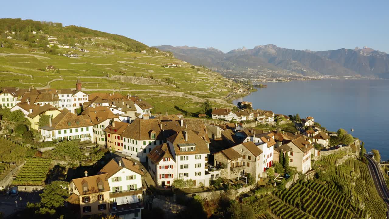 Low orbit close to typical village (Rivaz) in Lavaux vineyard, SwitzerlandAutumn colors and sunset light
