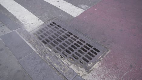 new york city sewer with pedestrian walking on the main capital city street road