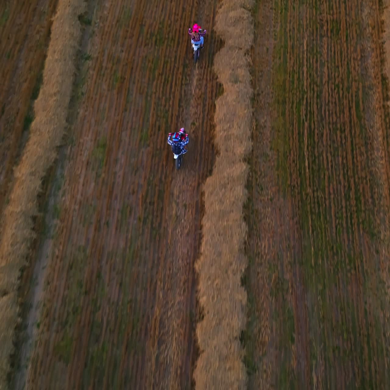 Motocross meadow riding. Bike extreme countryside traveling aerial view
