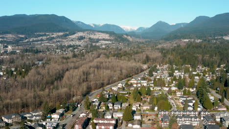 aerial flying over a scenic residential neighbourhood in port coquitlam, british columbia, canada