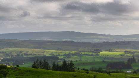 time lapse of countryside landscape with hills and fields on a cloudy dramatic autumn day in rural ireland