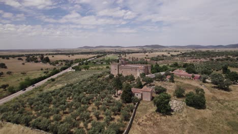 Medieval-castle-overlooking-via-de-la-plata,-aerial-orbit