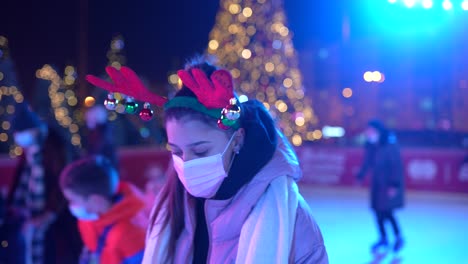 girl ice skating at christmas night