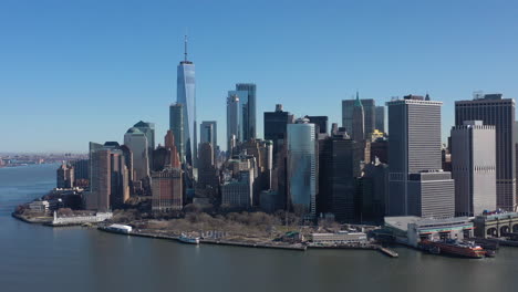 an aerial view of new york harbor on a sunny day with blue skies