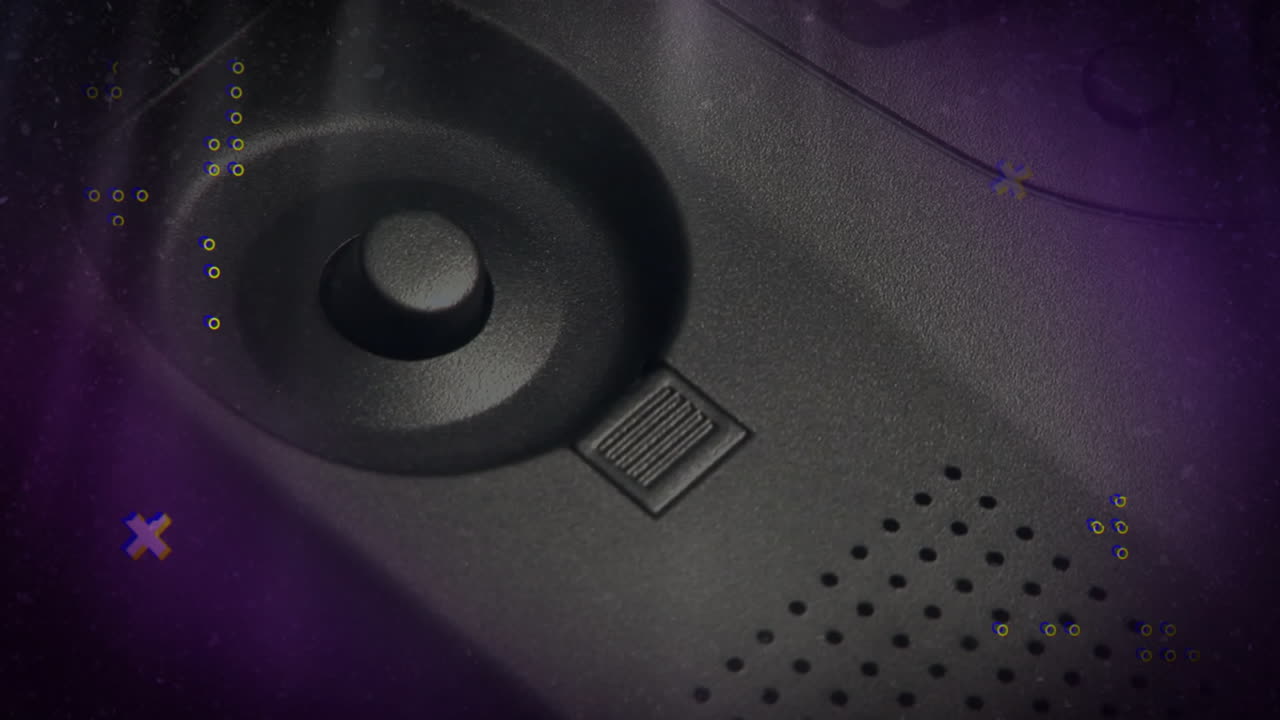 Matte-black panel being lit by purple glitch, showing dial knob slider, speaker holes, cable arc