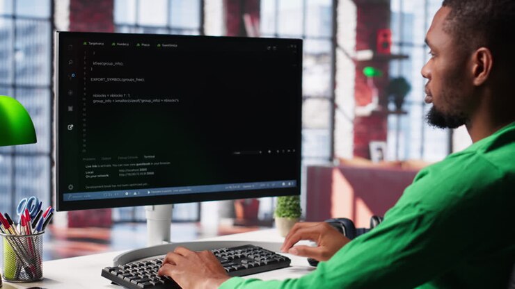 Vertical Video Male programmer types code on computer and running script