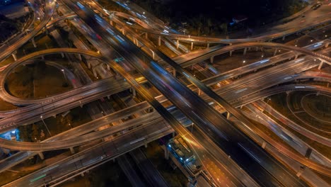 aerial hyperlapse of traffic over big intersection bridges and ring road. 4k aerial view by a drone over big roundabout in bangkok thailand.