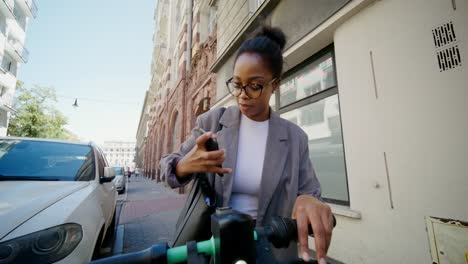 woman on electric scooter in city