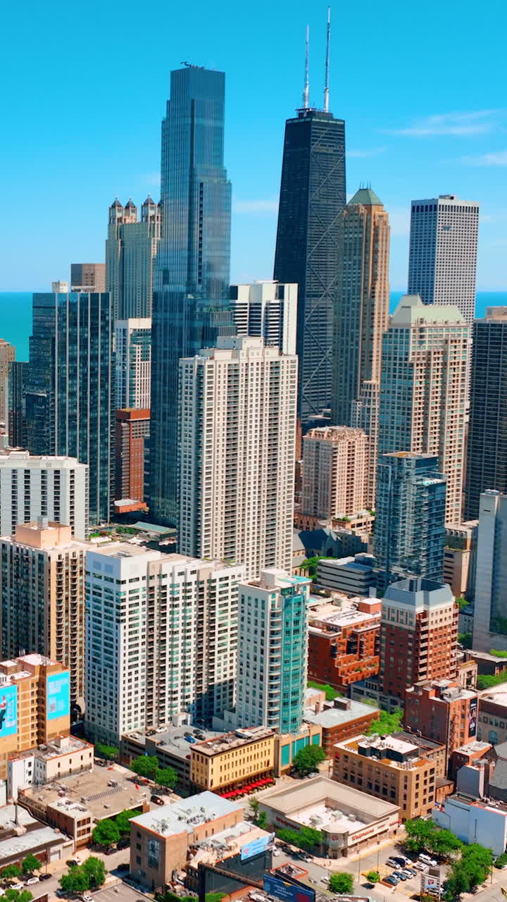 Chicago, Illinois, USA - June 01, 2024: Aerial view of landmark John Hancock Center located on Michigan Avenue in downtown Chicago. Vertical video