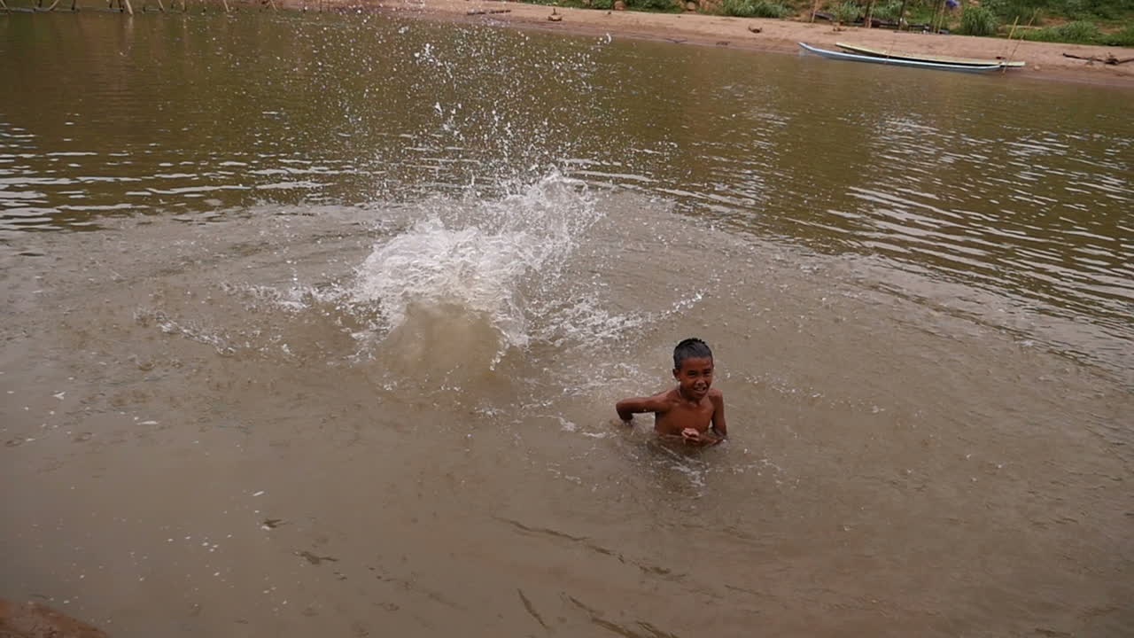 Children Playing in a River