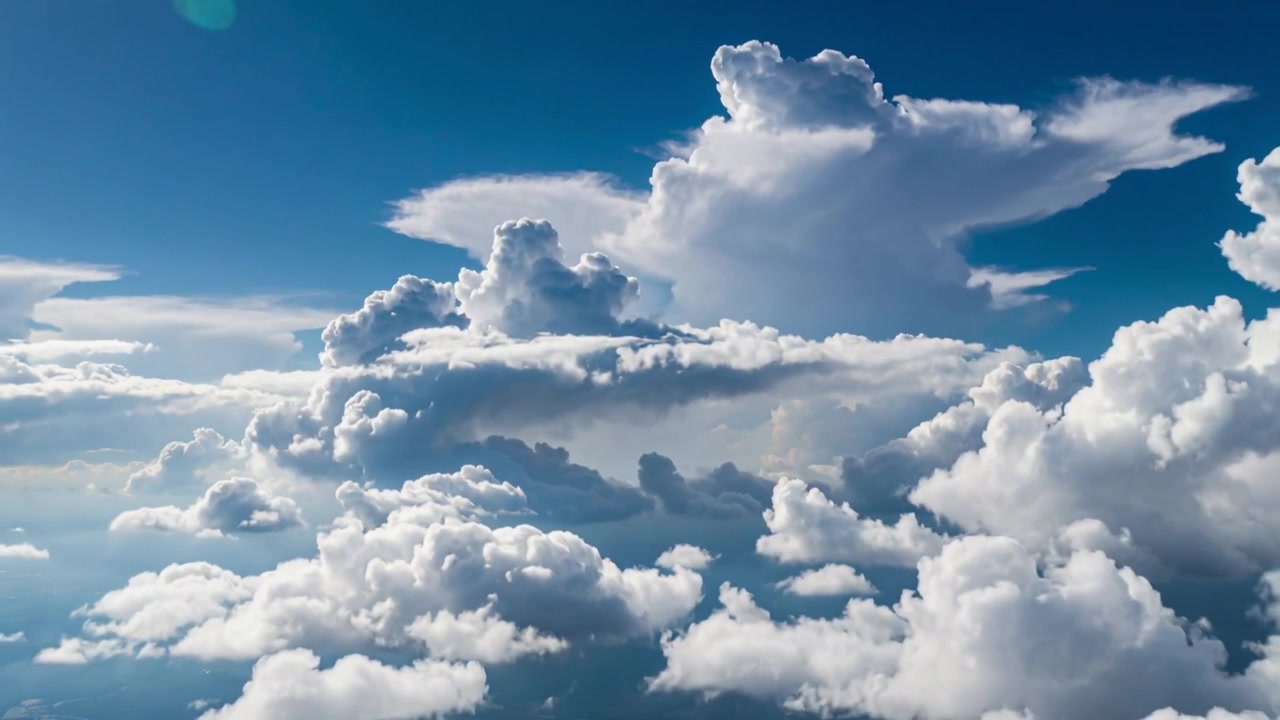 Shifting camera showing anvil cloud and cumulus over sky, flight revealing texture and green flare