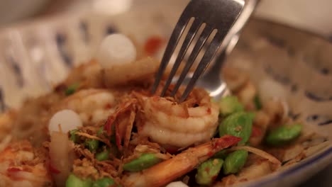 prawns and vegetables served over a rice mound