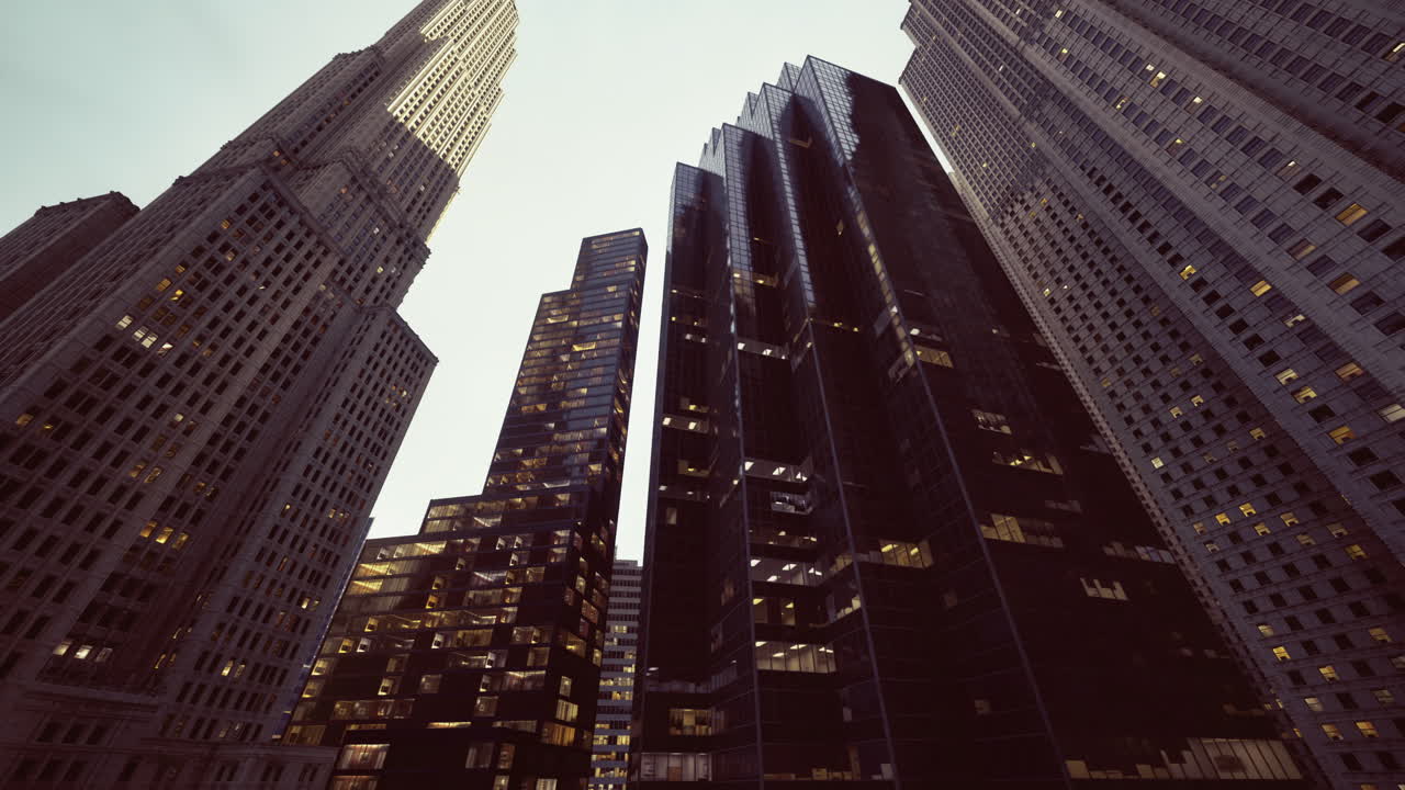 Skyscrapers reach toward the sky in a bustling urban landscape at dusk