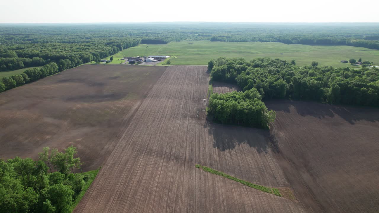 An aerial view of green meadow with grass