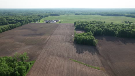 an aerial view of green meadow with grass